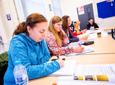 Group of female ESOL learners in classroom